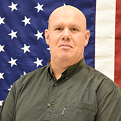 Aaron Baker portrait with American flag background